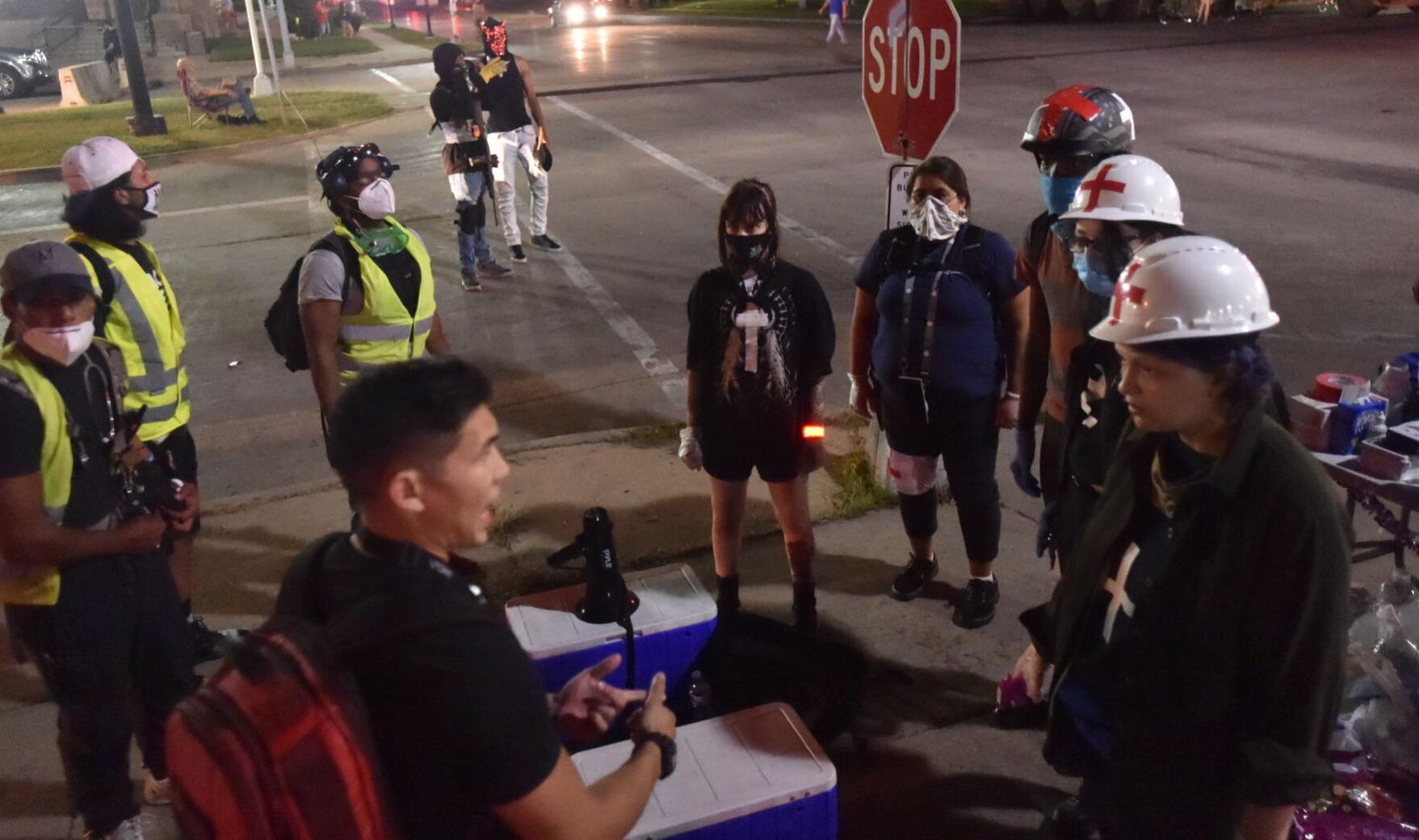 Street medics have a group huddle